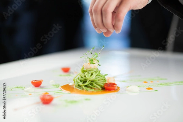 Obraz Chef preparing a pasta dish