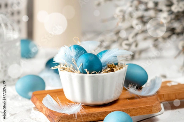 Obraz Blue easter eggs on light background