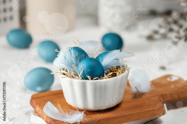 Obraz Blue easter eggs on light background