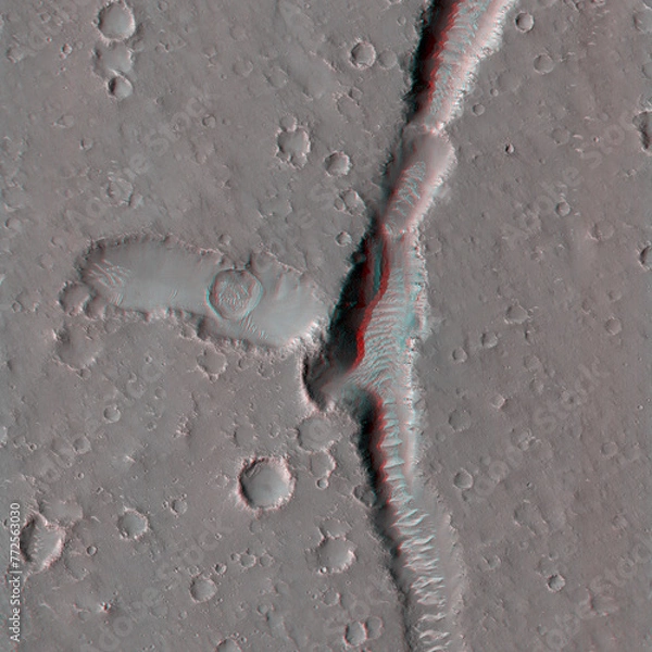 Obraz Mars in 3D. Pits and Troughs in Utopia Planitia. Anaglyph image. Use red/cyan 3d glasses.
Image from the Mars Reconnaissance Orbiter. NASA/JPL/University of Arizona.