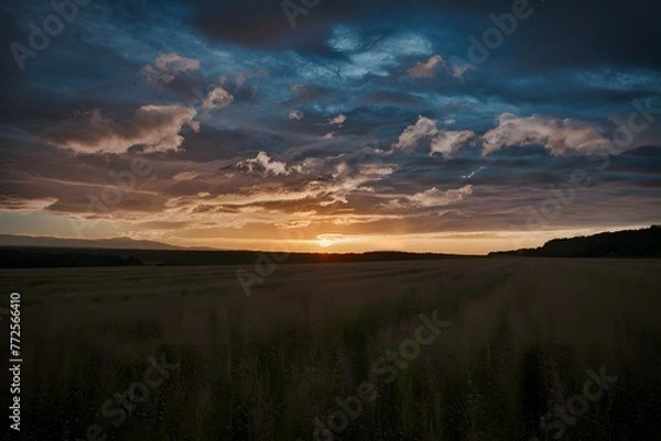 Obraz Dramatic sky provides a stunning backdrop to the setting sun