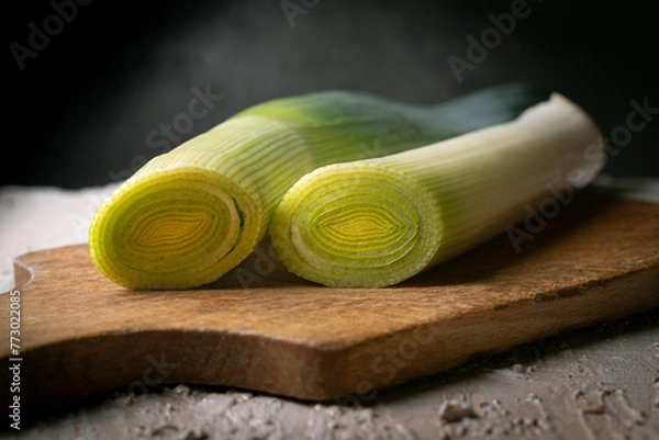 Obraz Sliced leek on a wooden board.