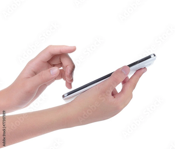 Fototapeta Hand holding and operating a smart phone isolated on white