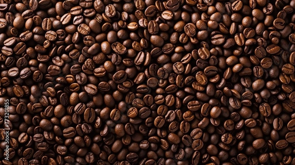 Fototapeta A close-up of coffee beans background with blank space for advertising or text.