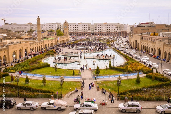 Fototapeta Erbil, Kurdistan, Iraq, Traffic jam ,Popular cafes, fountain, Bazar park, Erbil Governorate, Iraq,Erbil castle tower clock