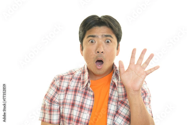 Fototapeta 驚いた表情の男性