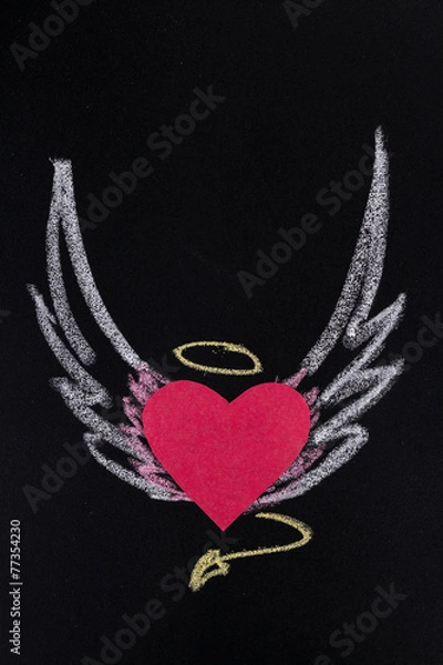 Fototapeta paper heart with pictured chalk wings on black background