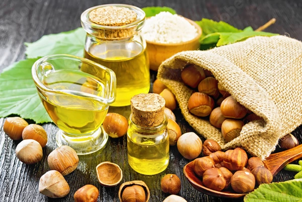Obraz Oil hazelnut in vial on board