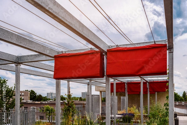 Fototapeta Pergola Awning on Roof Patio Garden. Modern Fabric Folding Pergola on Metal Frame Construction. 