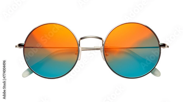 Fototapeta A pair of sunglasses resting on a surface, one lens tinted orange and the other tinted blue
