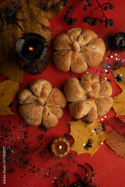 Fototapeta Baked Halloween pumpkins on a red background