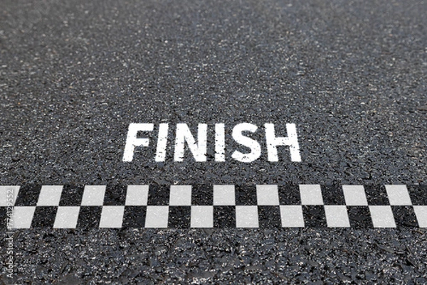 Fototapeta Finish line racing background top view, Textured asphalt with finishing line.