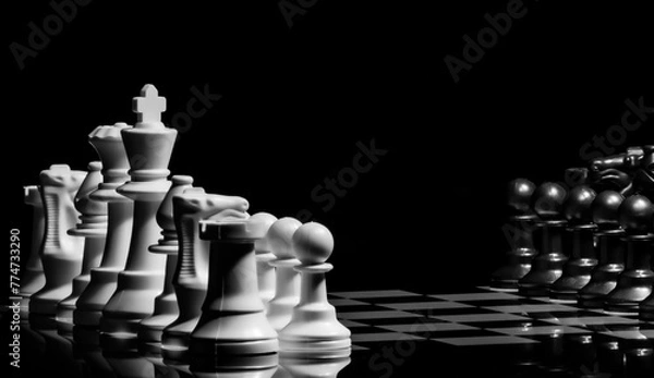 Fototapeta Close up of Chess pieces on a reflective mirror board surface wi