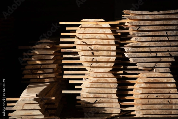 Obraz Stacks of cut boards at the woodworker workshop