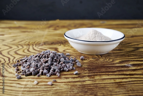 Obraz Black Kala namak salt in a salt shaker and on a wooden table