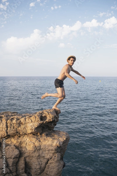 Obraz A man is dipping from a high cliff