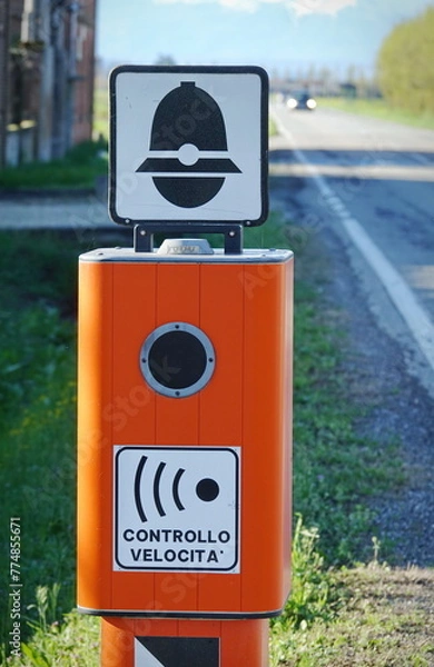 Fototapeta Traffic Enforcement Camera with TEXT that means electronic speed control in italian language and symbol of police
