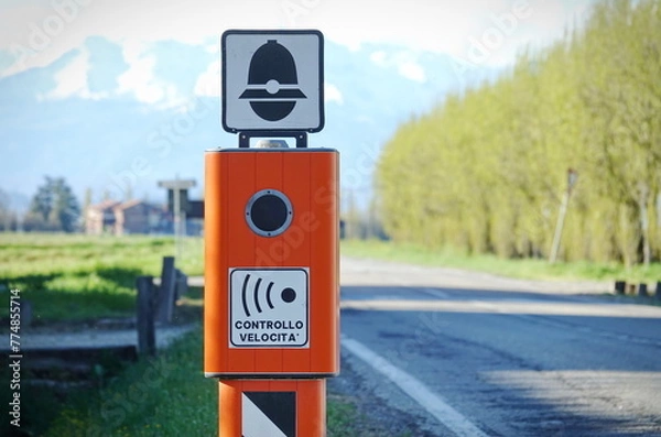 Fototapeta Traffic Enforcement Camera with TEXT that means electronic speed control in italian language and symbol of police