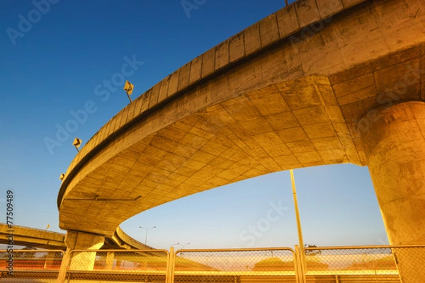 Fototapeta Light trails under highway bridge