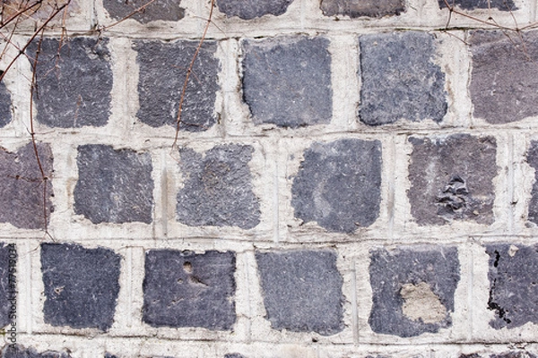 Fototapeta a gray stone wall  background