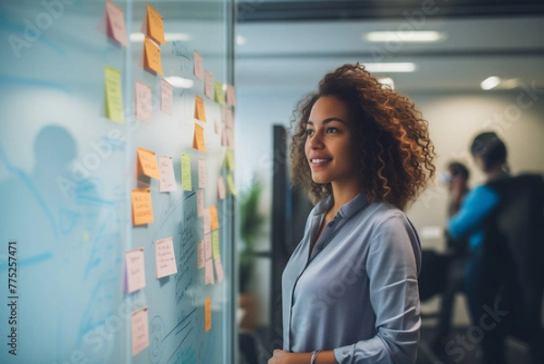Obraz A woman standing in front of a white board in office
