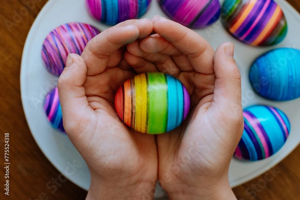 Obraz Hands Holding a Rainbow Easter Egg 