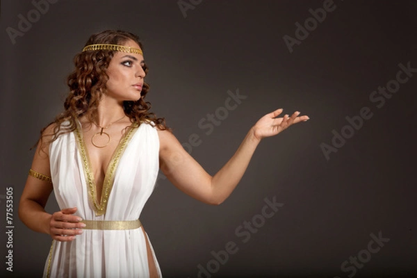 Fototapeta Classical Greek Goddess in Tunic Showing Something