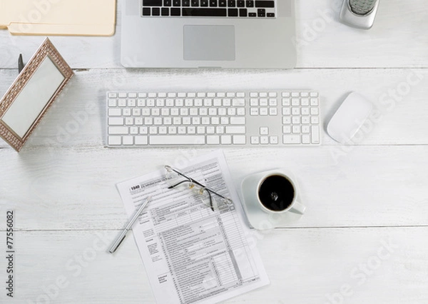 Fototapeta Office desktop with financial tax forms