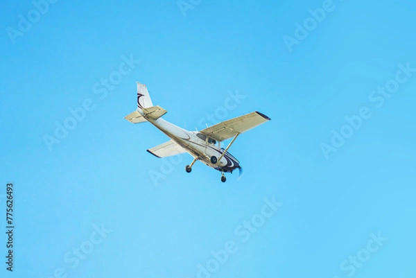 Fototapeta Small airplane against sky
