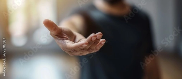 Obraz Man's hand reaching out offering help and support. Help, support, care concept