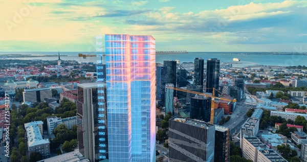 Fototapeta Aerial Drone Shot of Building Construction Finished with VFX: City Real Estate Development Site Transforms with Hight Tech 3D Graphics Big Data Analytics. Visualization Urban Design Progress