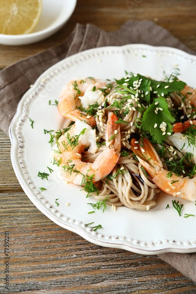Fototapeta Soba with shrimp and greens on a plate