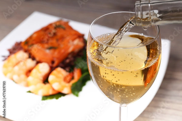 Obraz Pouring white wine and background