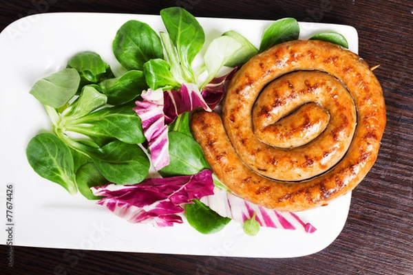 Obraz Grilled sausages snail with easy side dish of corn salad, red