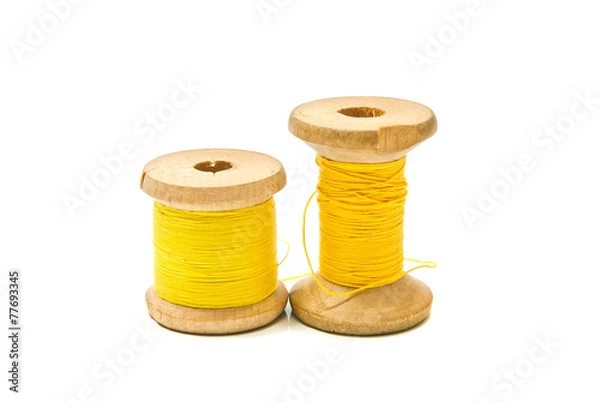 Fototapeta spools of yellow thread