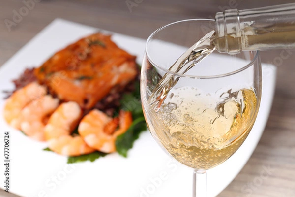 Obraz Pouring white wine and background