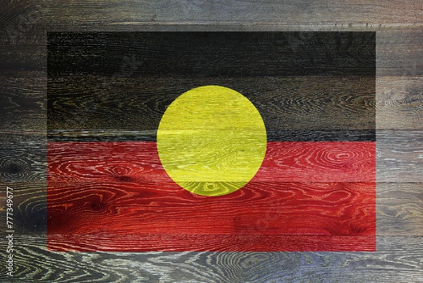 Fototapeta Australia aboriginal flag on rustic old wood surface background