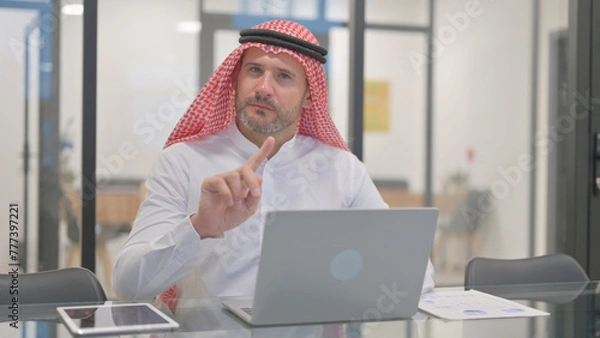 Obraz Rejecting Arab Man with Disliking Gesture at Work