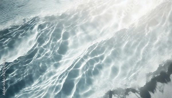 Obraz Ripple water texture on white background. Shadow of water on sunlight. Mockup for product spa or travel background. Marble blue water surface as wallpaper background