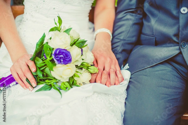 Obraz Bride and groom holding hands.