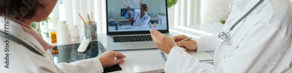 Fototapeta Web banner with group of doctors having online conference discussing new treatment