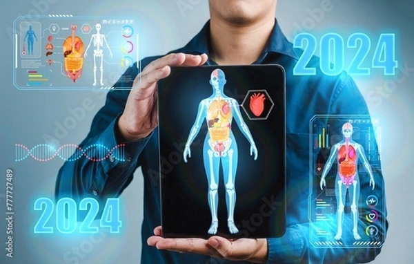 Fototapeta 2024 Medical and tech health care :A man is holding a tablet with a picture of a human body organ,2024 Organ application tablet technology