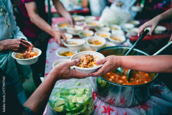 Fototapeta Help with feeding homeless people to alleviate hunger. poverty concept