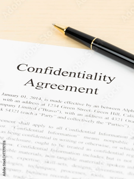 Fototapeta Confidentiality agreement document with pen close-up