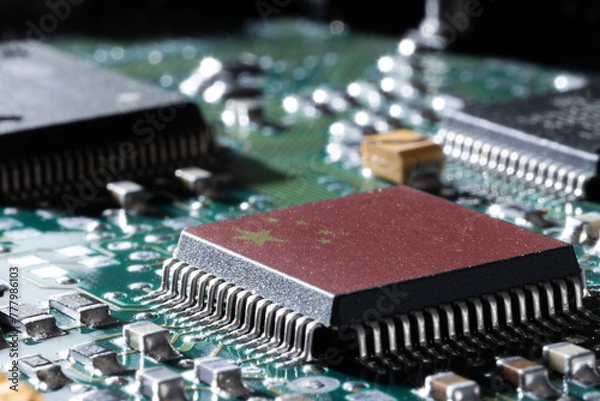 Fototapeta Computer circuit board with Chinese flag on one of the silicon chips political concept
