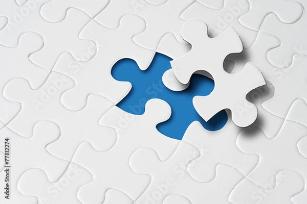 Obraz Missing jigsaw puzzle piece with light glow, business concept