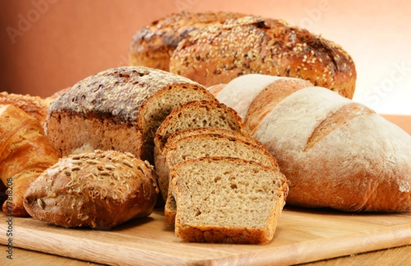 Fototapeta Composition with bread and rolls. Baking products