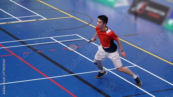 Obraz young man plays single badminton
