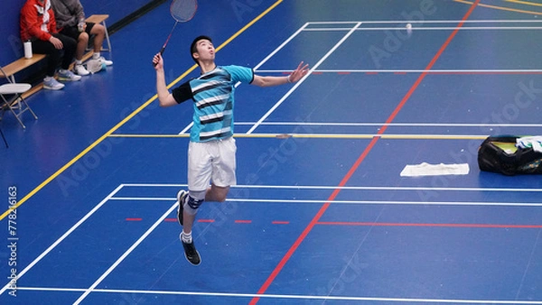 Obraz young man plays single badminton