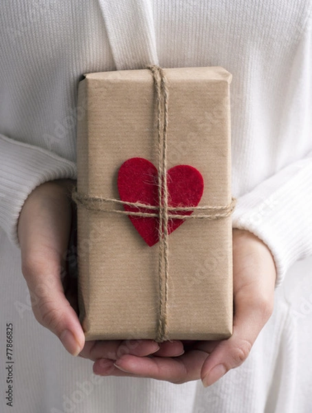 Fototapeta Female hands holding gift